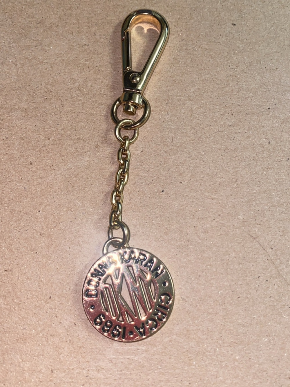 Donna Karan DKNY Gold Tone Round Medallion Keychain